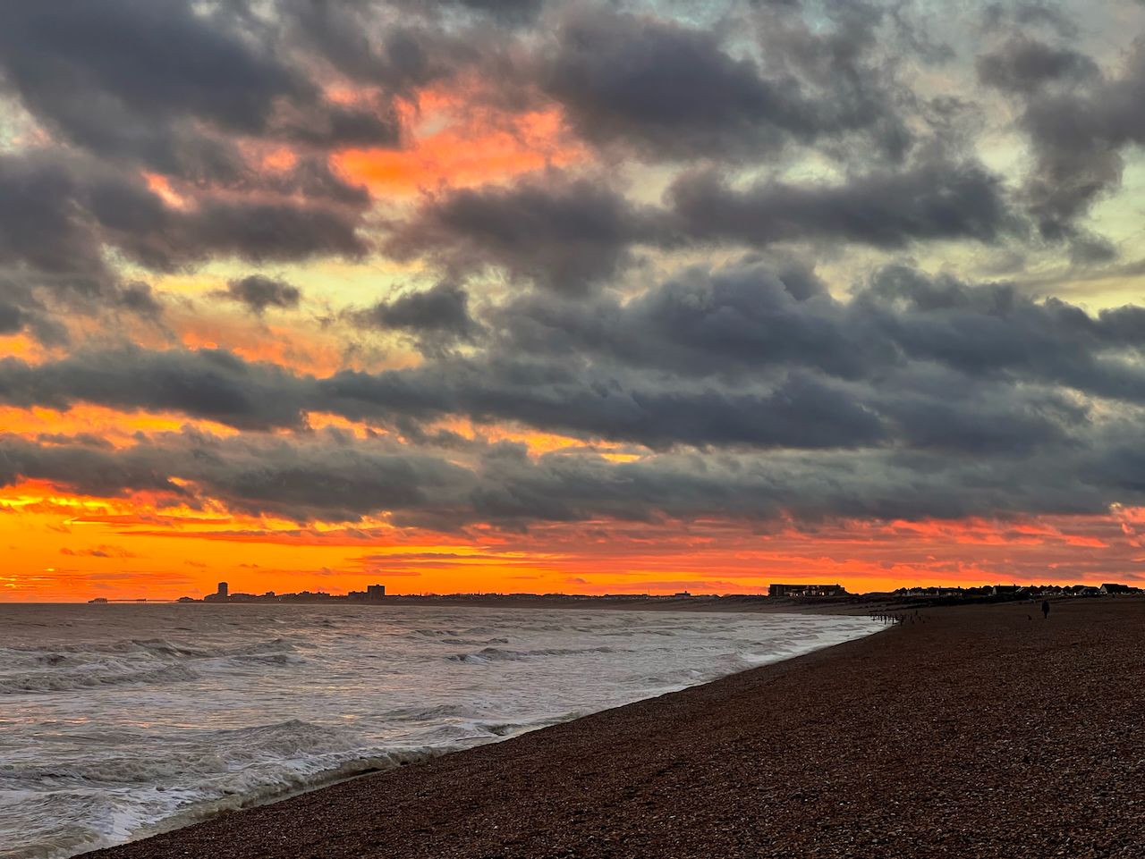 A stormy sunset over Shoreham Beach, looking west to Worthing pier.